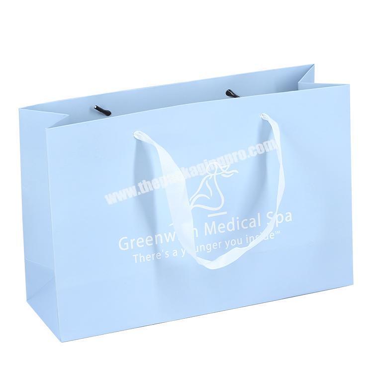 New custom logo packaging gift bag , custom foldable blue paper bag for skin care product packaging