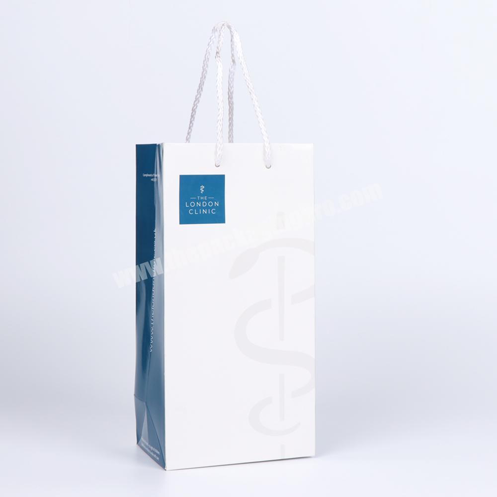OEM design wholesale custom logo coloful fancy cardboard paper gift shopping paper bag with PP rope handle