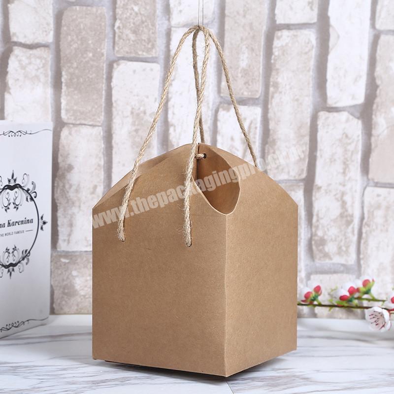 OEM Factory Creative design Hand Brown Paper Boxes Favors Food Packaging Gift Box With Handle 14.5x14.5x18cm