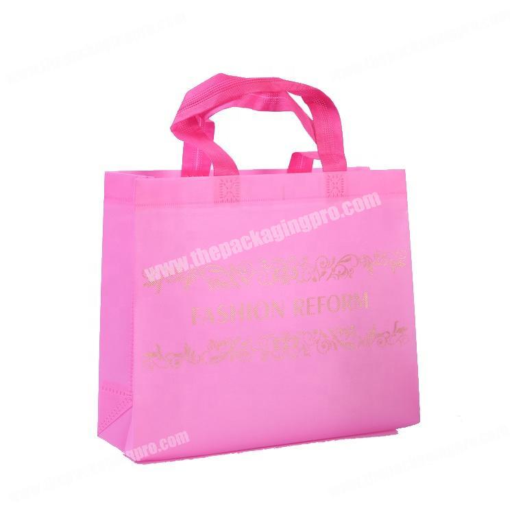 Promotional pink non woven bags totes with gold logo