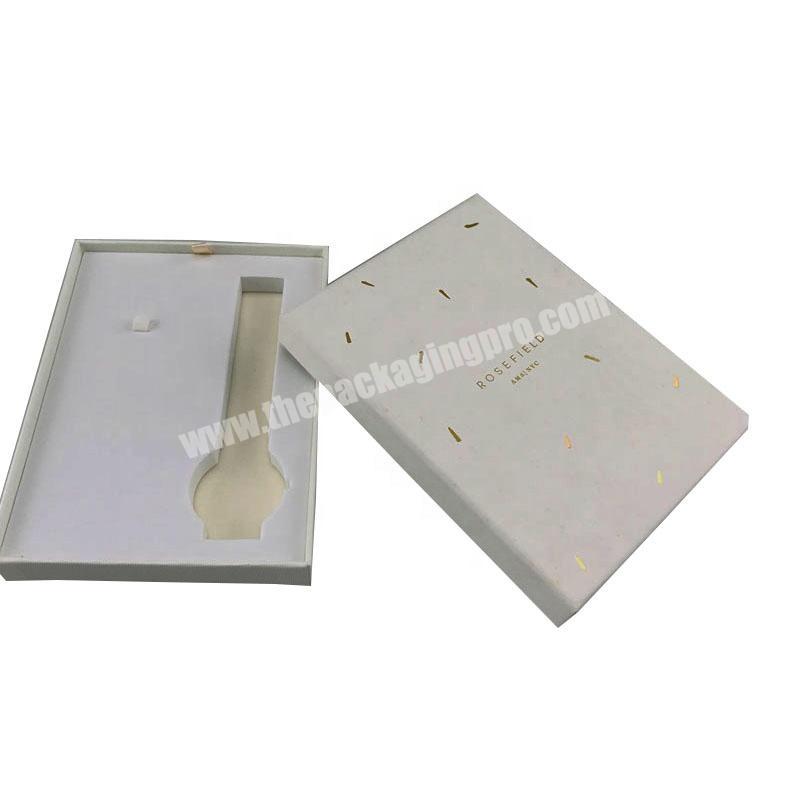 rectangle lid base white embossing pattern paper laid flat lady watch packaging box with white EVA inlay