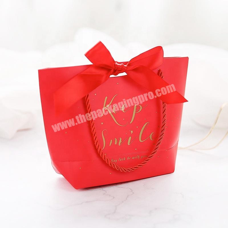 Retail Custom Made Festival Promotion Red Unique Christmas Paper Bag Tote Thick Shopping Bag With Bow Tie