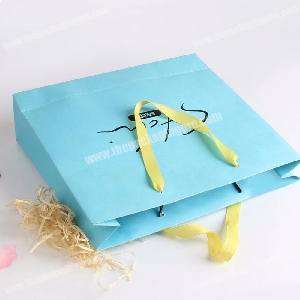 ribbon handle embossed logo china gift paper packaging bag manufactures