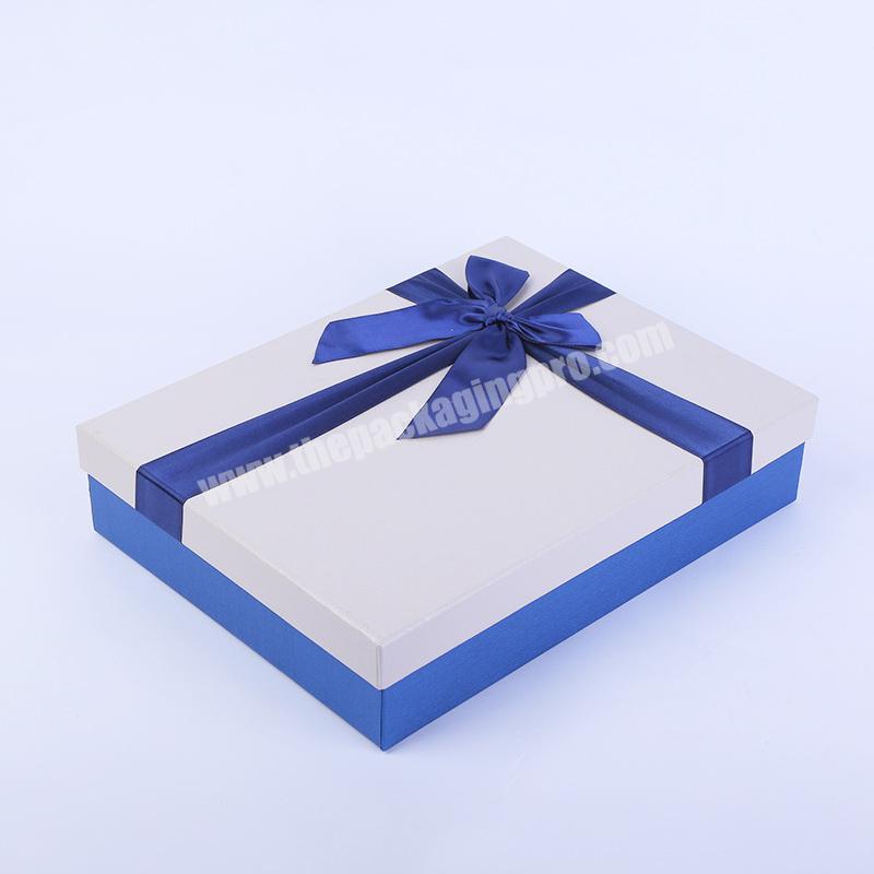 square paperboard gift box packaging with ribbon