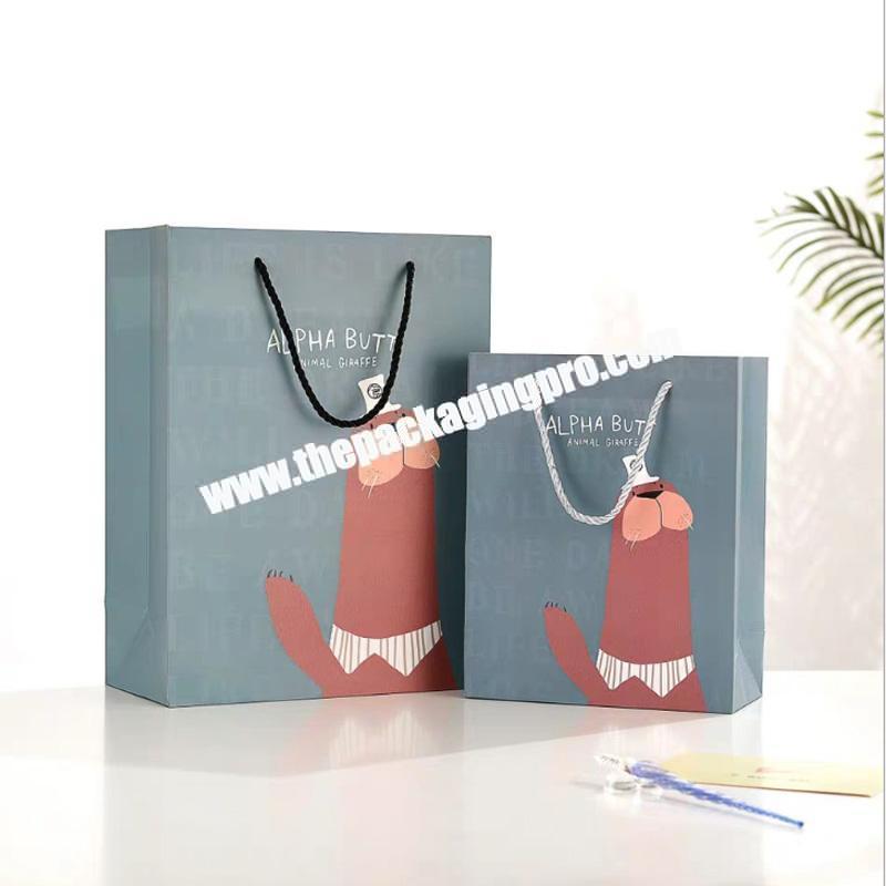 Strong Fashion Luxury Gift Shopping Packaging Custom Emboss Paper Bag With Ribbon Handles
