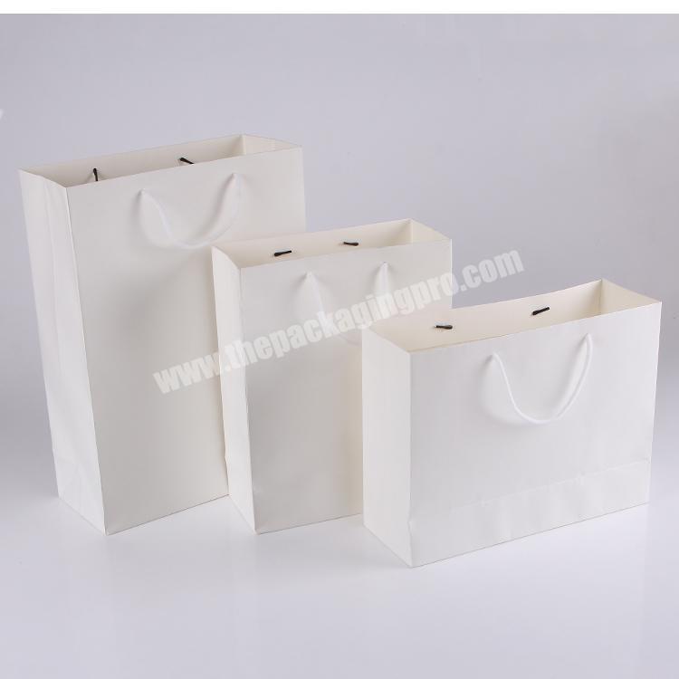 Top quality cutome printing embossing fancy paper luxury package gift bag with cotton cord