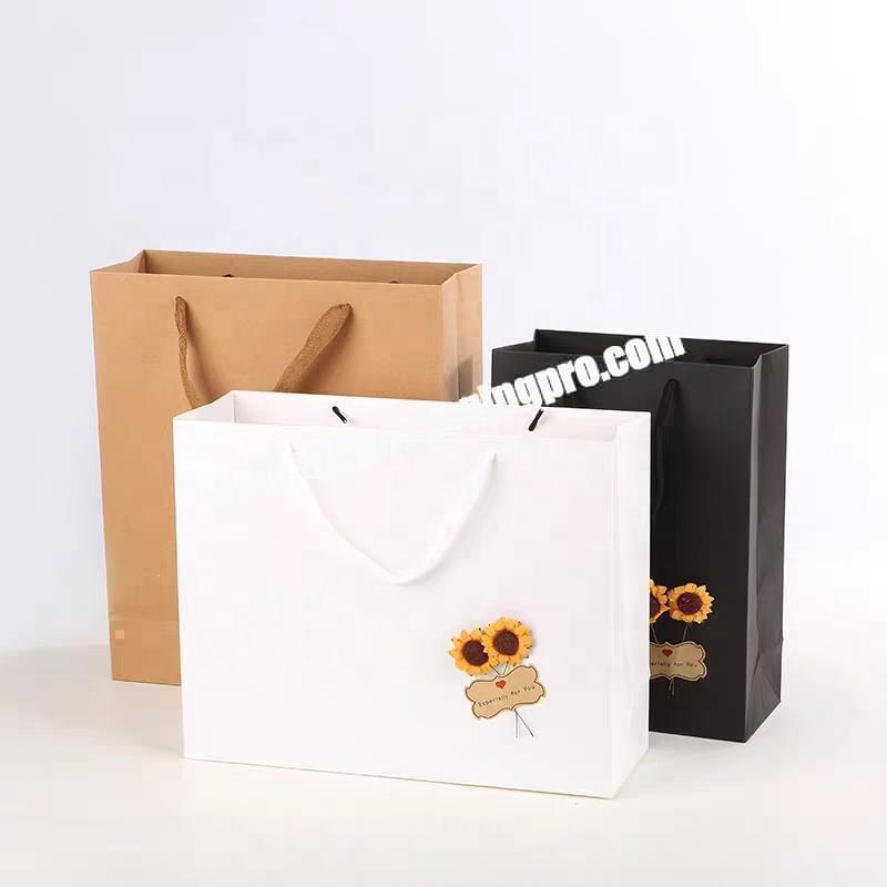 White and black embossing kraft paper bag with gold foil logo for lady