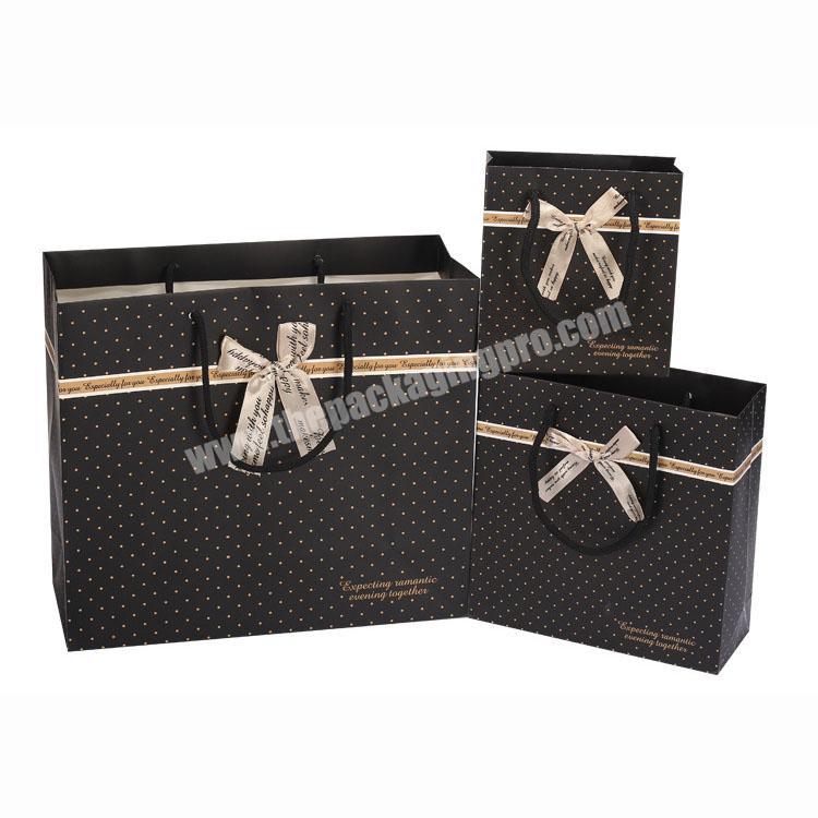 Wholesale black rope handle clothing packing gift  bags with bowknot decoration
