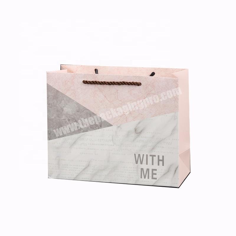 Wholesale CMYK color clothing store paper shopping bag