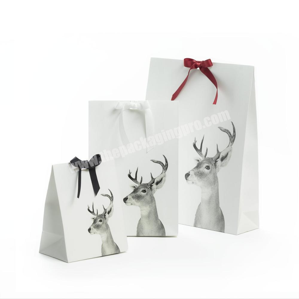 Wholesale custom logo paper white gift bag with a ribbon bow