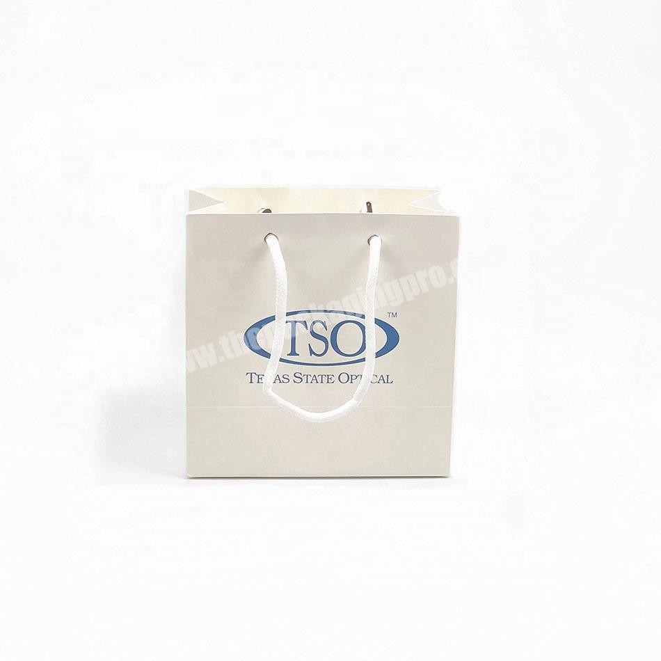 Wholesale Custom Logo Simple Printing White Kraft Paper Packaging Gift Paper Shopping Bag