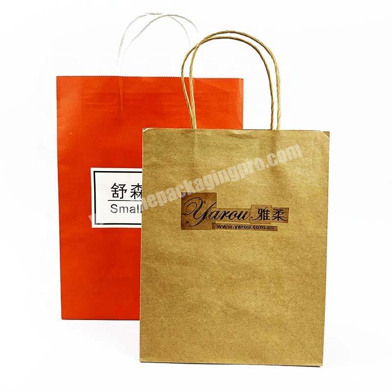 Wholesale custom recyclable kraft paper printed clothing packaging carry bags with handle