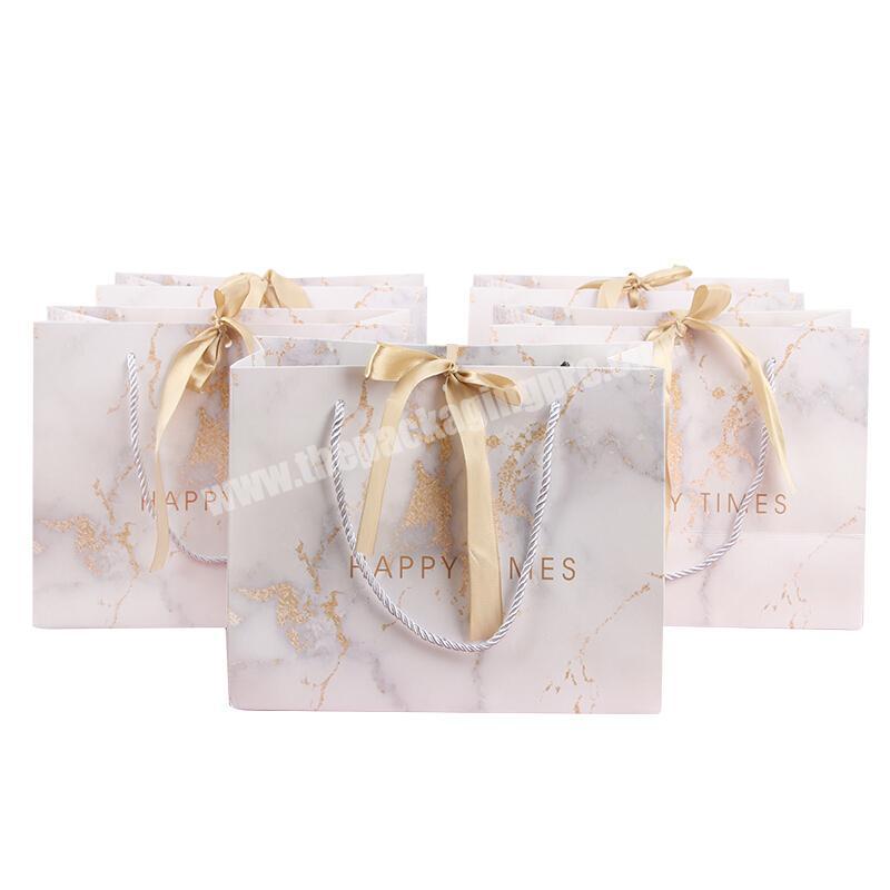 Wholesale Customized logo Packaging White Marble Kraft Gift Craft Custom Shopping Paper Bag With Matt Ribbon Handles