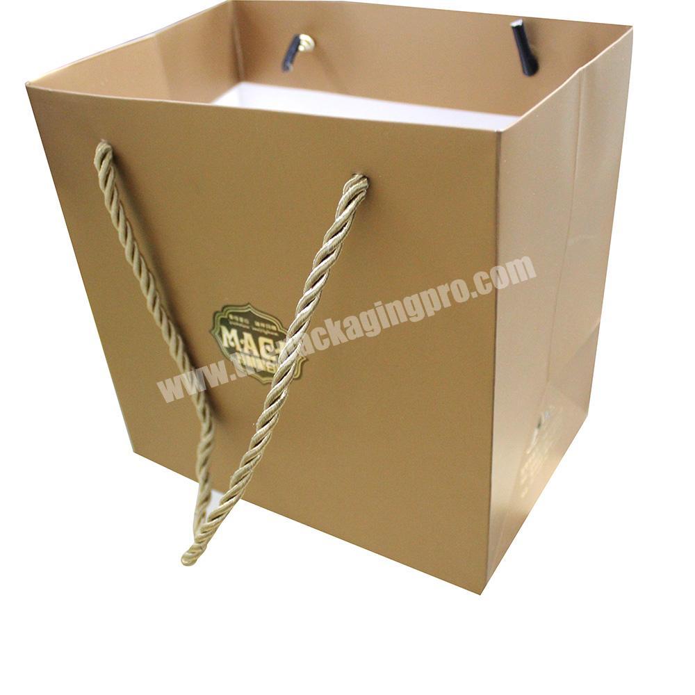 Wholesale hand-held gold square bottom decorative handmade paper bag