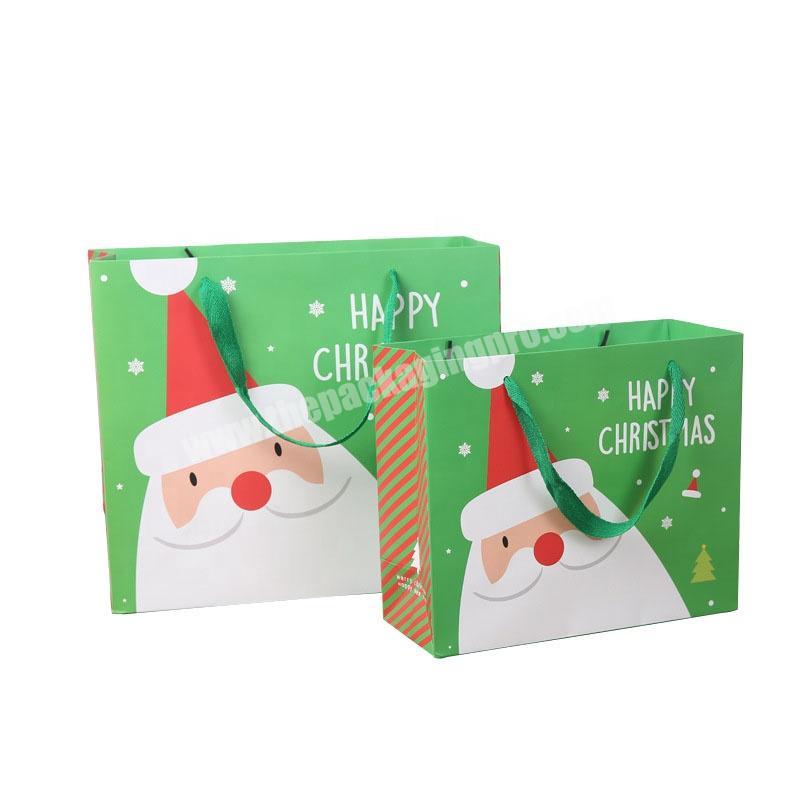 Wholesale luxury design Christmas gift paper  bags with ribbon handle