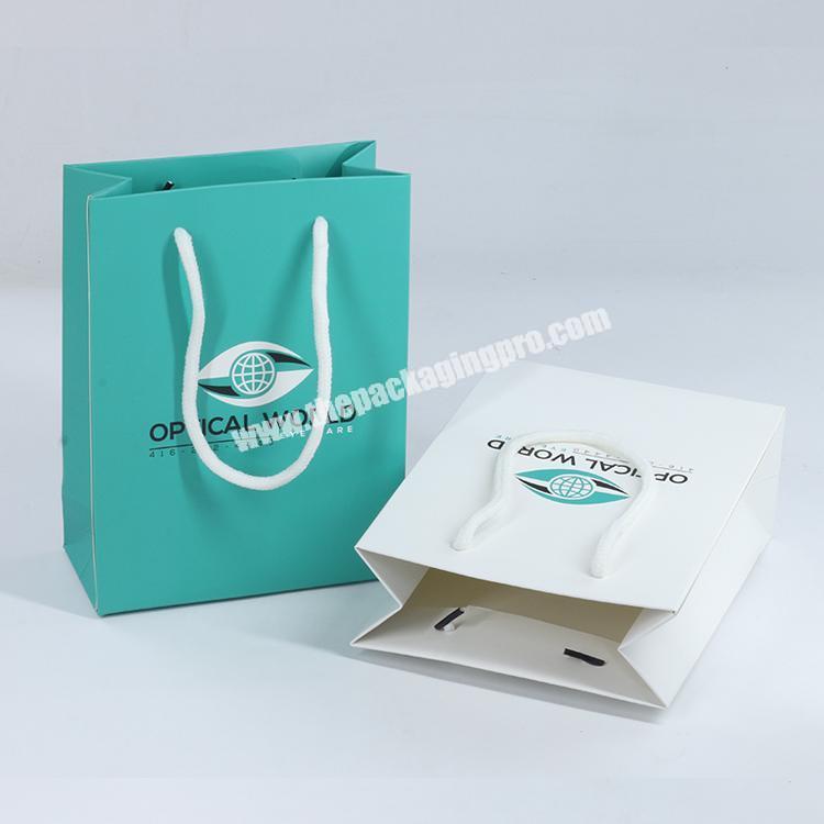 Wholesale luxury famous brand gift custom printed shopping packing paper bag for wholesale