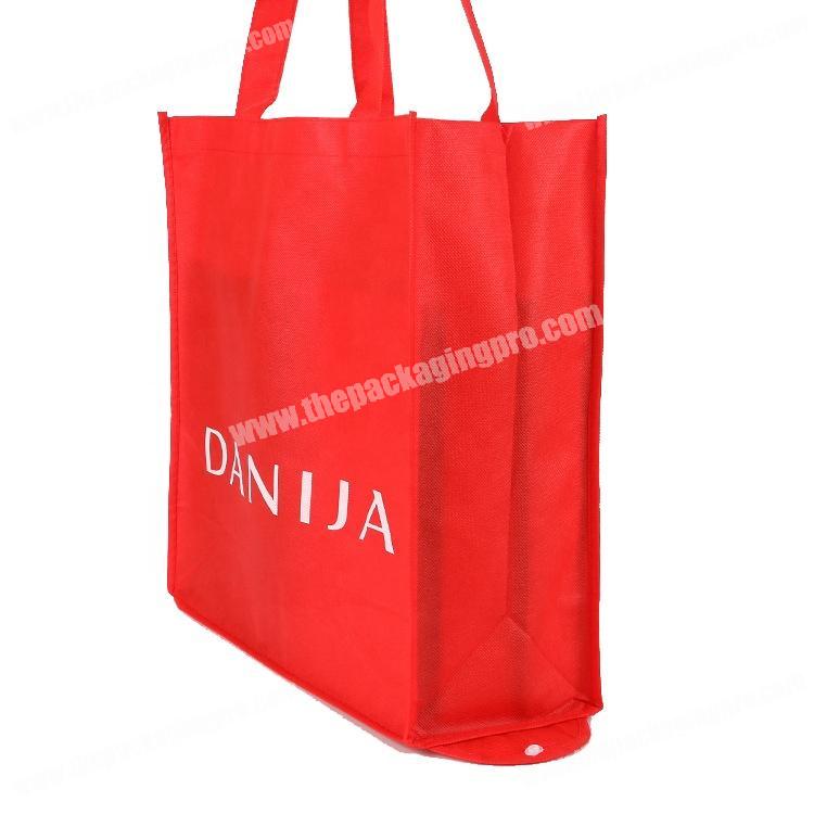 Winter coat pocket carry red non woven reusable folding bag for promotion
