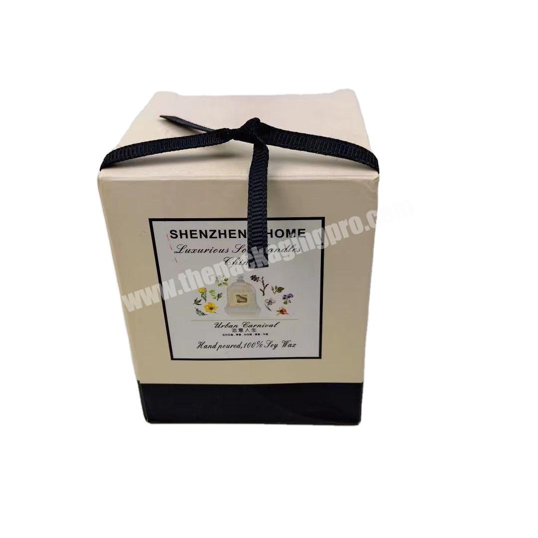 Beautiful white art paper square candle box with black ribbon