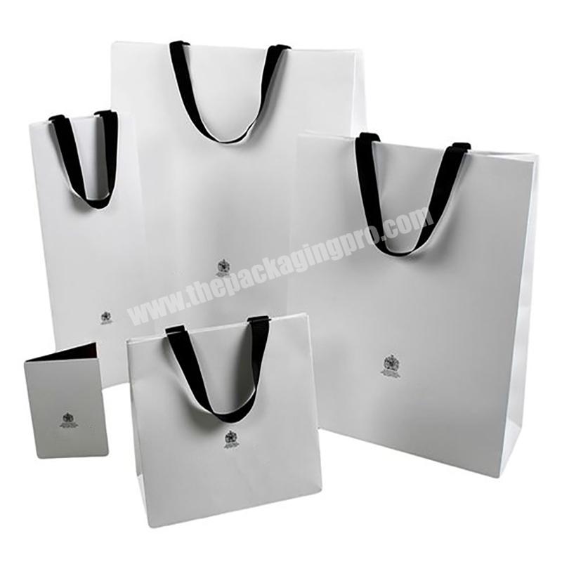 Cheaper price customized matte black color printed luxury design white elegant clothing shopping gift bag with ribbon