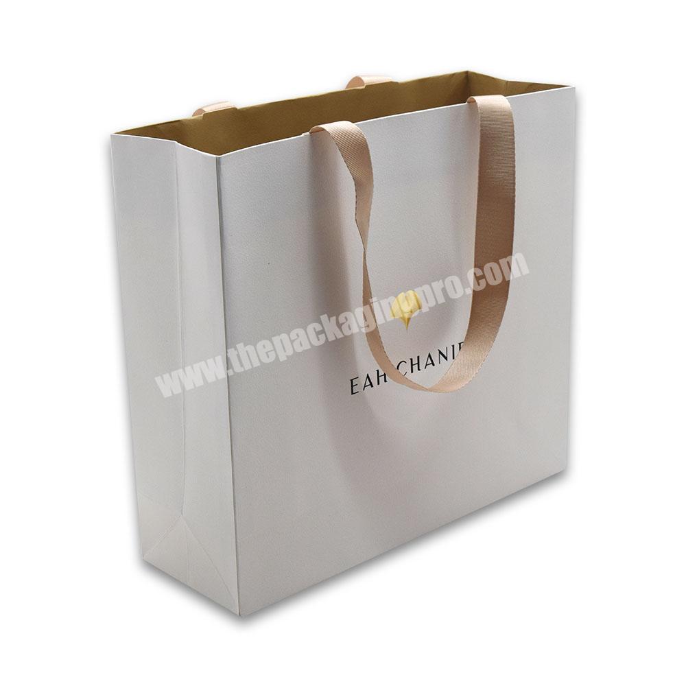 Custom New Gold Logo Hot Foiled Stamping White Matt Kraft Paper Bag With Silk Ribbon Handles