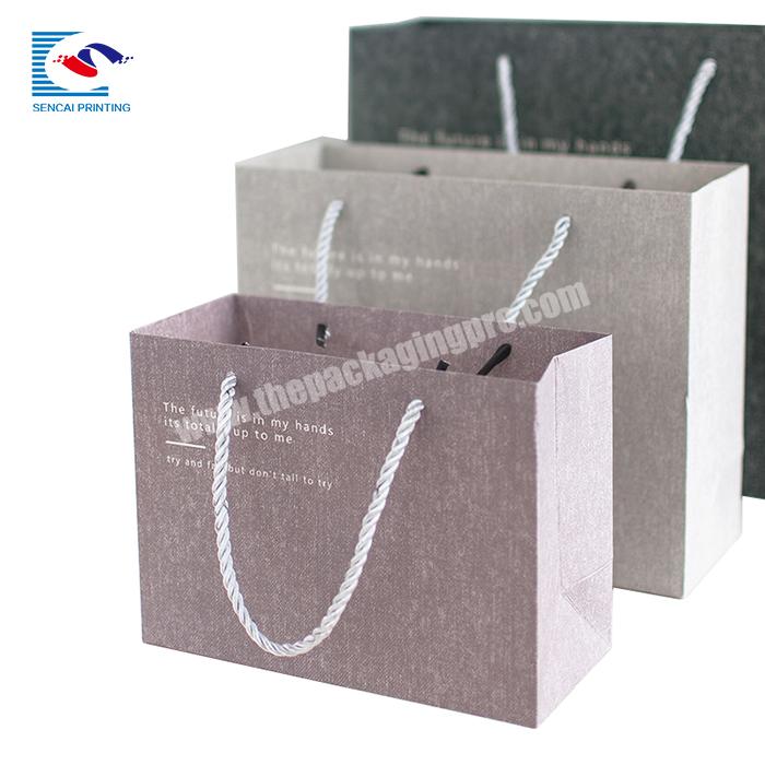 High quality custom logo garment shopping paper bag with handles