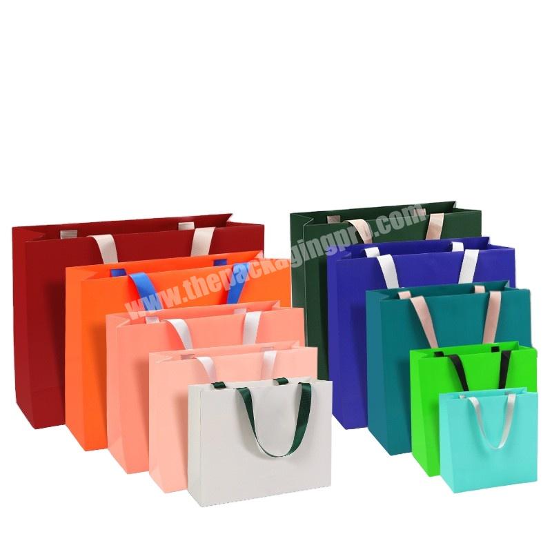 Luxury  Custom high-grade  wholesale clothing store paper bag gift bag Shopping bag with thick handle