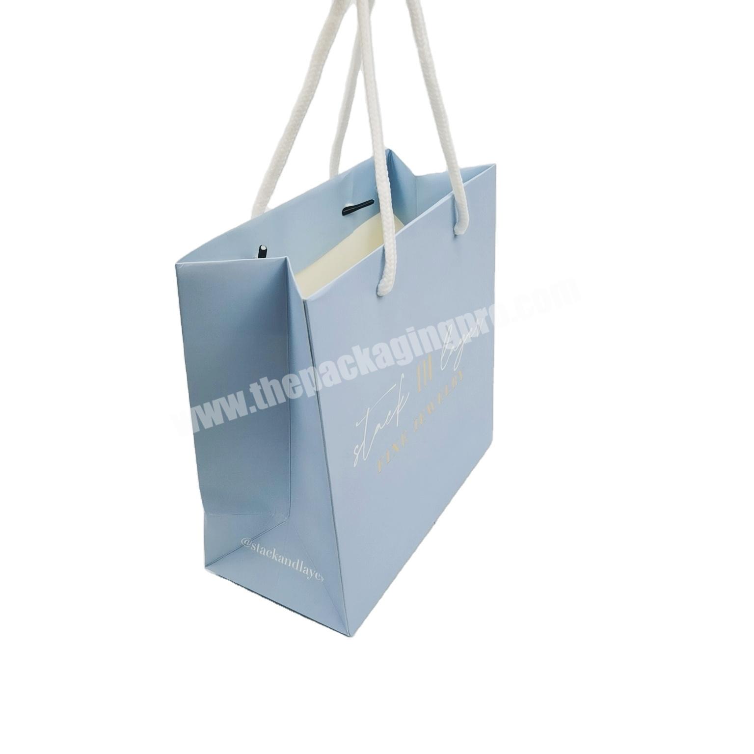 Personality custom printed luxury brand paper bag retail shopping packaging clothing paper bag with logo