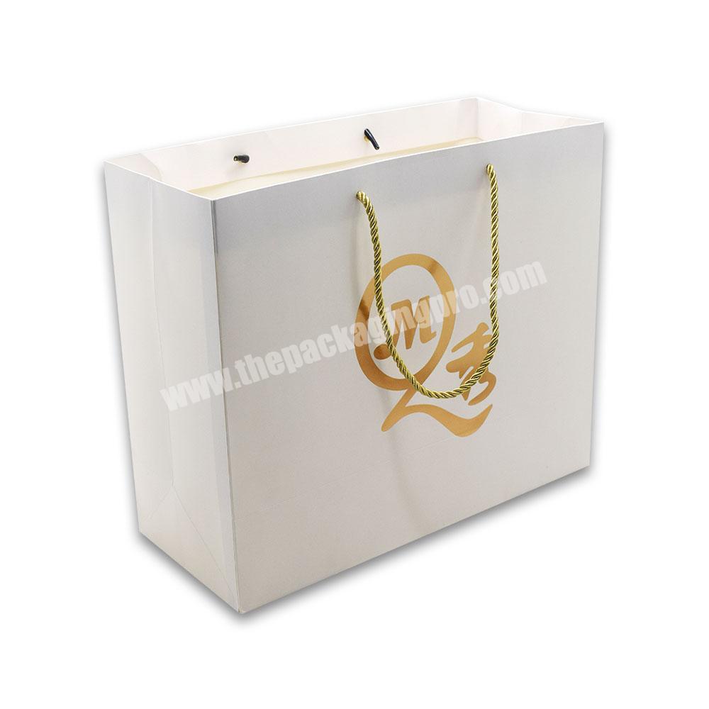 Promotional Gift Luxury Shopping Paper Bag Customized Gold Foil Logo Stamping Wedding Gift Souvinir Clothing Packaging Bag