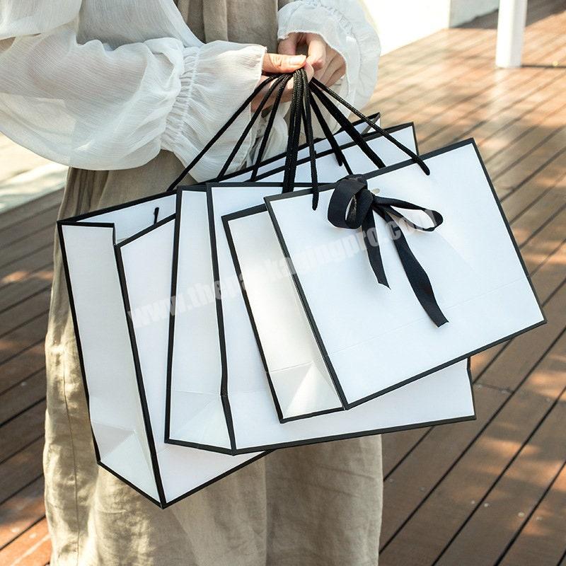 Wholesale High Quality luxury Recyclable White Black Shopping Customized Kraft Paper Bag With PP Rope Handle