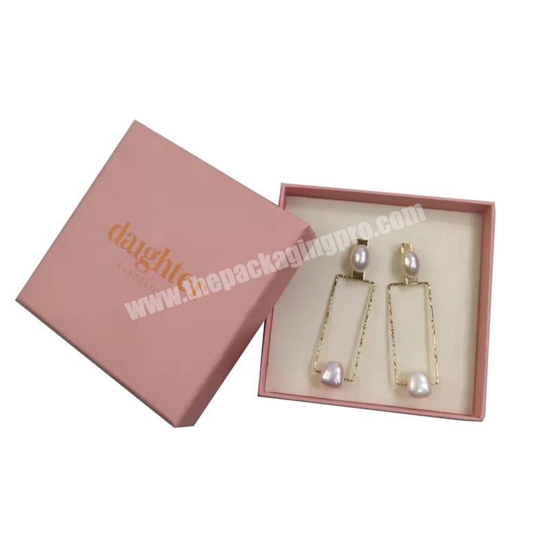custom pink cardboard small jewelry gift box packaging for earring ring white sponge insert embossed logo design