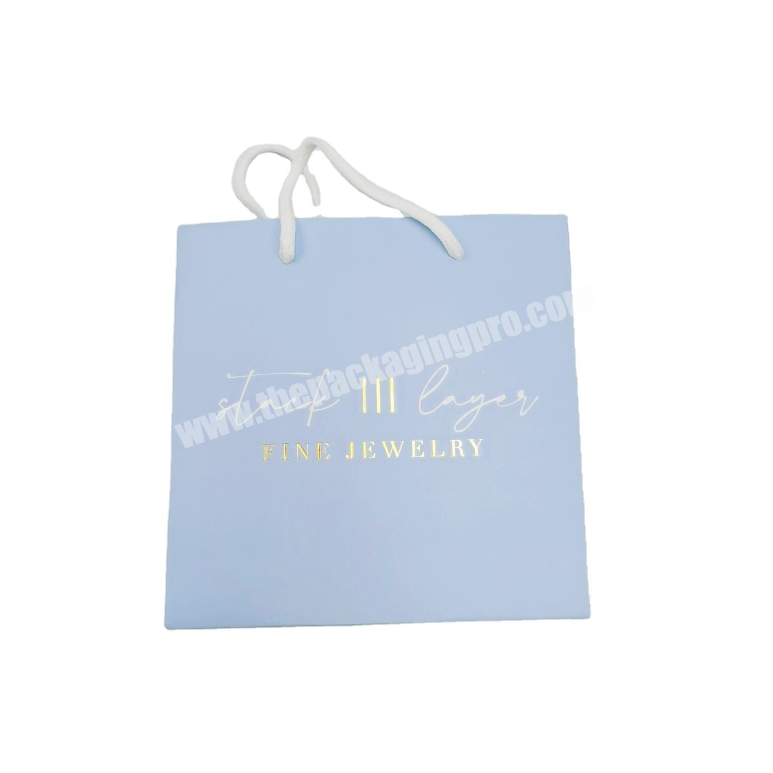 free sample private logo blue color gold stamping clothes paper bag with PP handle