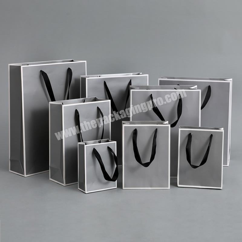 China Factory Custom Print High Quality Cheap Price Ribbon Handle Art Paper Gray Shopping Paper Bags