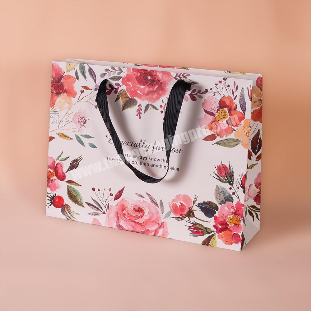 Clothing luxury wholesale eco-friendly craft shopping portable paper packaging bag with handle