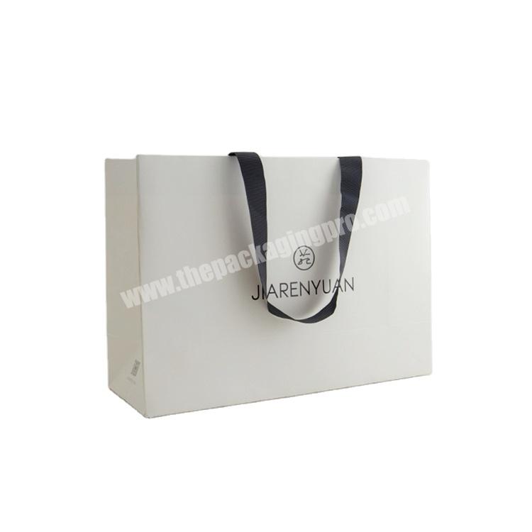 Custom Logo Foldable White Retail Paper Gift Bags Wholesale Luxury Shopping Bag for Clothes