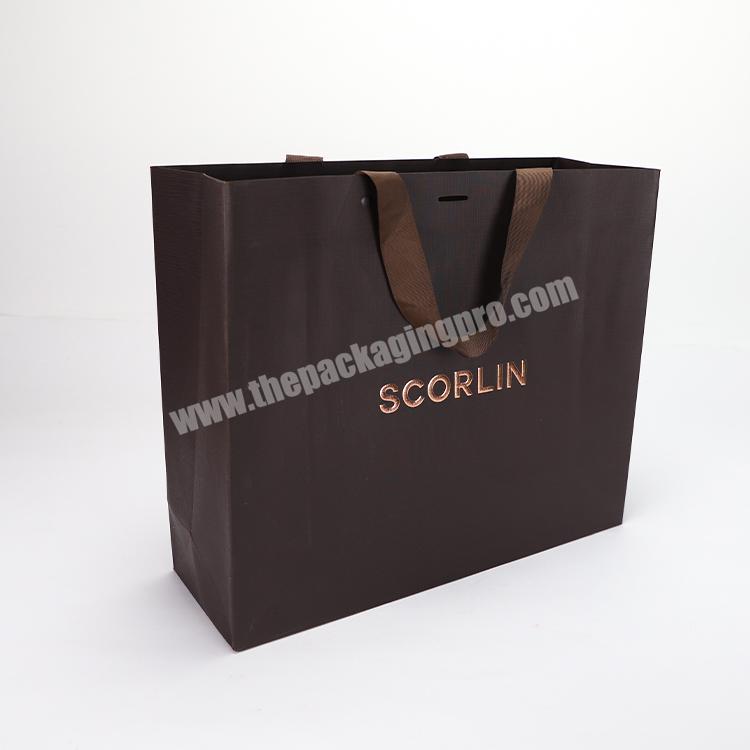 Factory direct supply customized logo luxury paper gift bag Clothes Packaging Paper Shopping Bag with handle