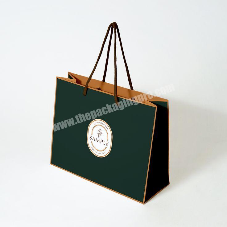 Low MOQ custom matt black printed luxury shopping paper gift bags with UV spot logos print