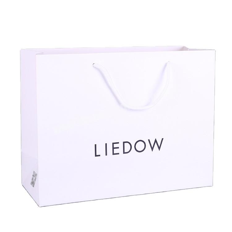 Luxury Thickened Branded Packaging Bags with Printed Logos White Kraft Paper Shopping Bags for Clothing