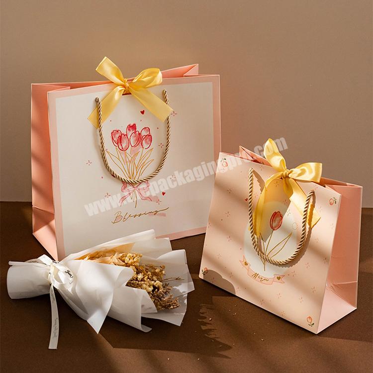 custom luxury kraft paper gift bag manufacturer christmas souvenir smile small gift bags with logo